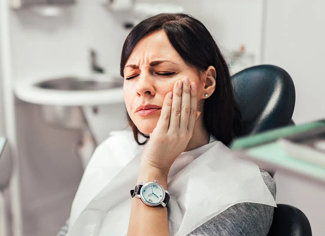 Close-up of a person reacting to a cold drink